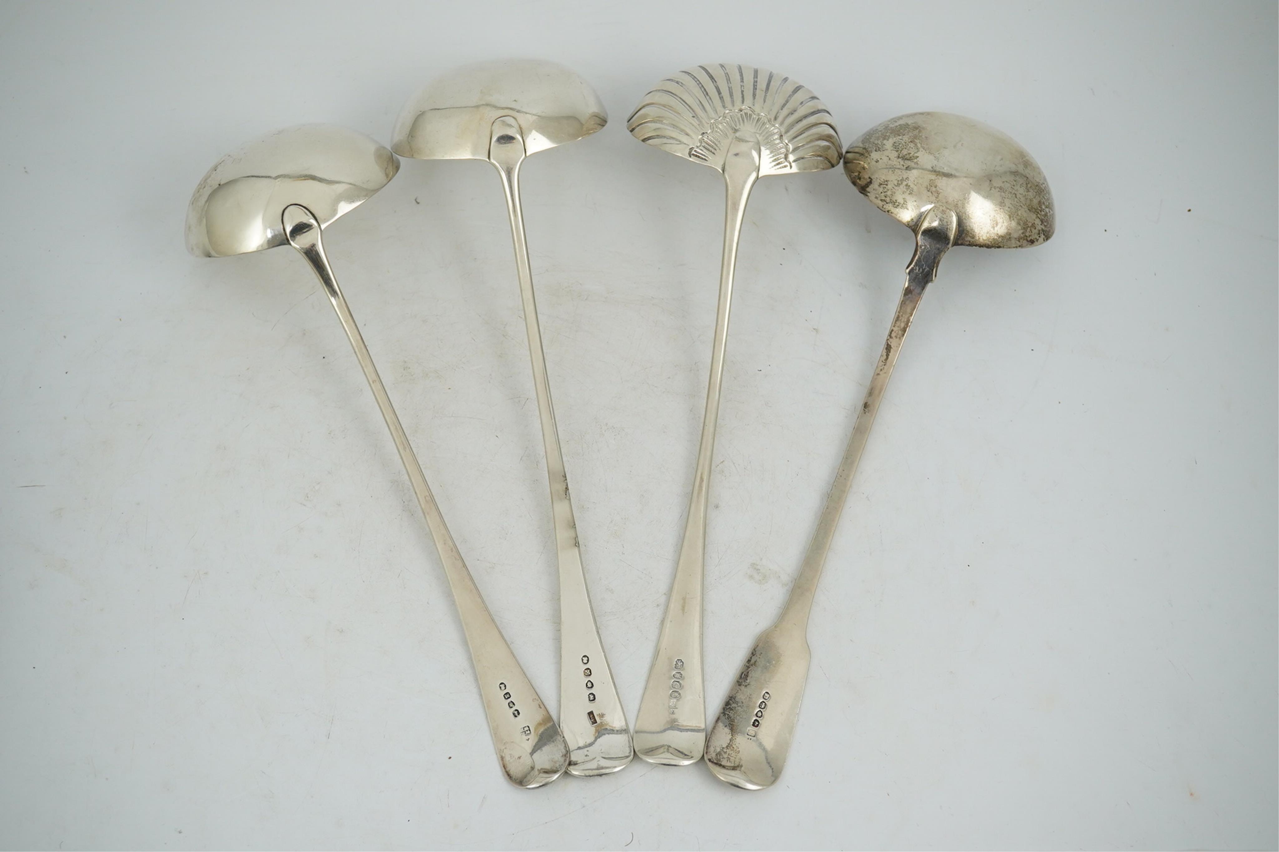 Three George III silver Old English pattern soup ladles, London, 1802, 1805 and 1808, various makers, together with a George IV silver fiddle pattern soup ladle by Eley & Fearn, London, 1821, 23oz.